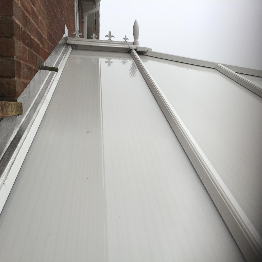 Conservatory roof after cleaning, spotlessly clean white panels